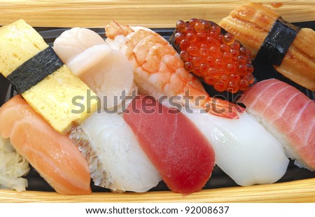 traditional Japanese Sushi set, seafood, raw fish and some kind of snack with rice balls