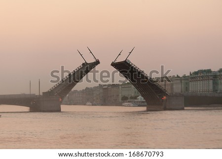 White nights of St.Petersburg, Russia. View of the Hermitage Museum and raised Palace Bridge.