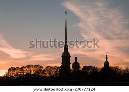 Silhouette of the Peter and Paul Fortress with sunset and sun lights. Saint-Petersburg, Russia
