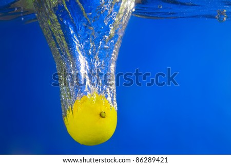 Lemon under water. Close up. Macro shot.