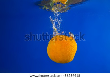 Orange under water. Close up. Macro shot.
