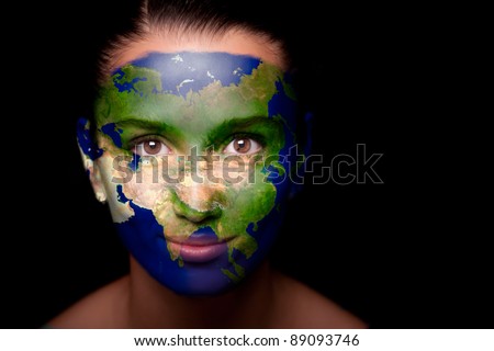 Girl with a painted map of Asia on his face. Closeup.