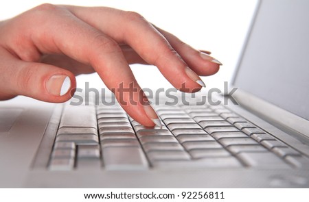 Work for the laptop. Hands and keyboard close-up