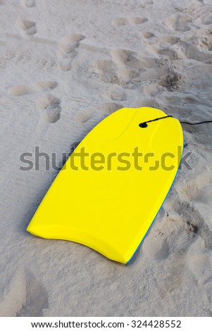 bodibord surf board on the sand, sand beach of Hendaye, France. summer beach hobby. Fun on the water.