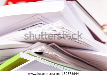 Close up of stack of old paper files