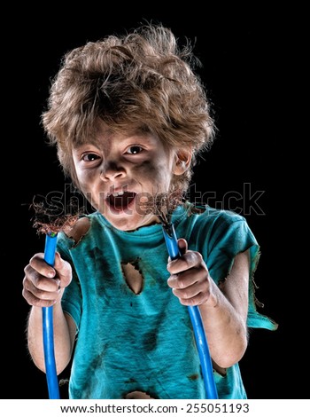 Portrait of crazy little electrician over black background