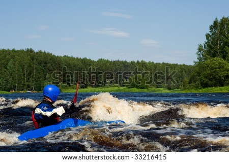 Kayaker sporting a kayak cuts through water