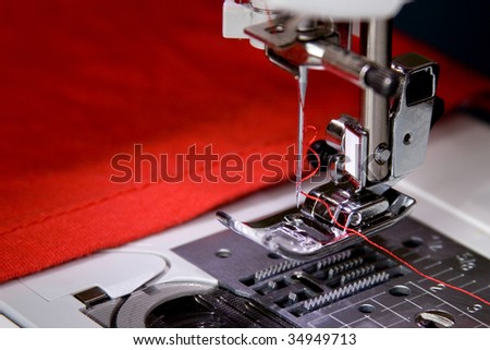 The sewing-machine costs on a table and is ready to work