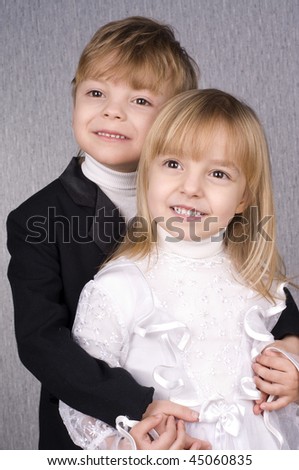 Happy children - brother hugging little sister