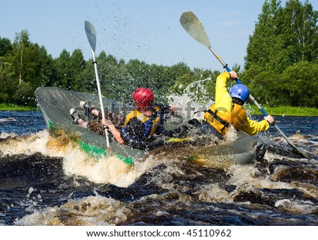 Kayaker extreme sporting a kayak cuts through water