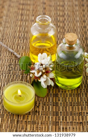 Tropical spring flower with massage oil,candle on mat
