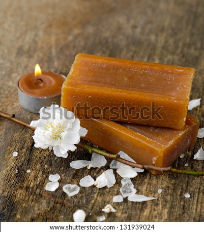 spring flower, soap with petals on old wooden