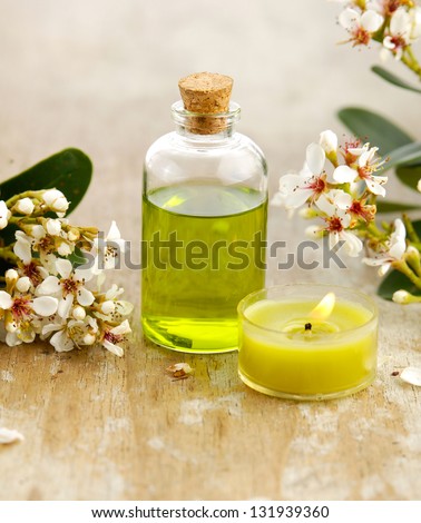 spring flower with massage oil ,candle on board