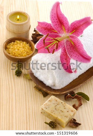 Aromatic spa set with salt in bowl ,massage oil , lily flower