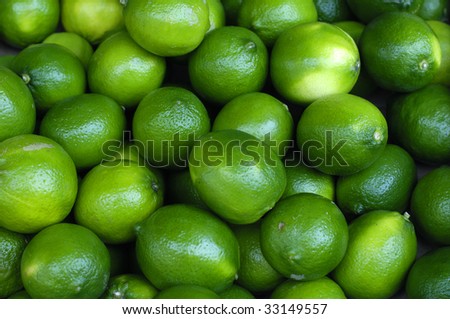 Fresh and green lemons background