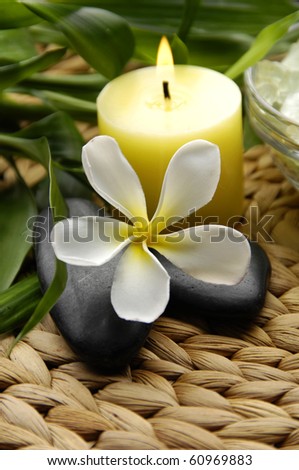 Spa resort composition - candles, orchid flowers, zen stones