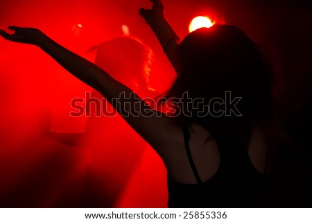 the silhouette of woman in night club