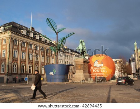 COPENHAGEN - DEC 12: A man walks past The Scouts for Climate Exhibit in Copenhagen on December 12, 2009.
