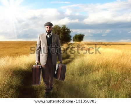 Emigrant man with the suitcases