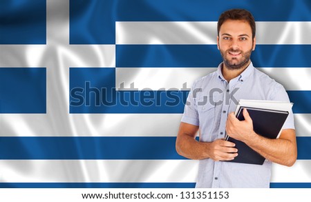 Young smiling student learns greek the language