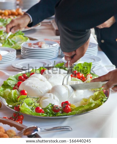 Sliced of Mozzarella in tray during a wedding reception