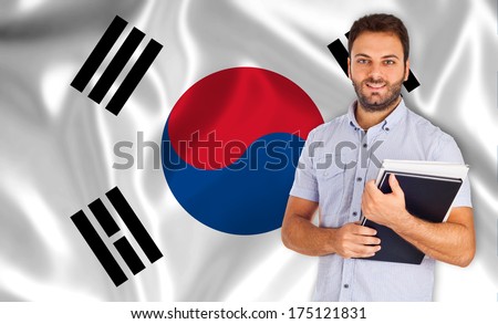 Smiling young student learns the korean language.