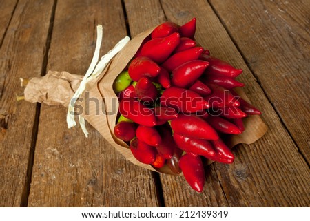 Bunch of fresh small red hot pepper made in Salento, Puglia, Italy.