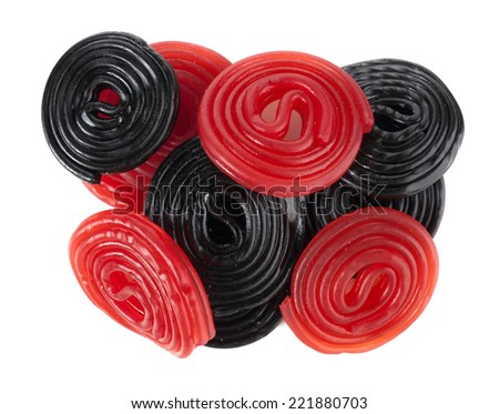 Red and black licorice wheels on a white background