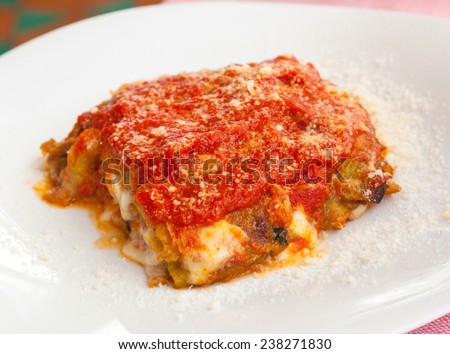 Original recipe of Parmigiana. iItalian food with eggplant, tomato and cheese.