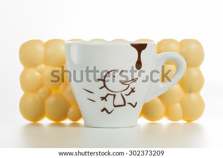White chocolate bar. Coffee cup. White background in studio