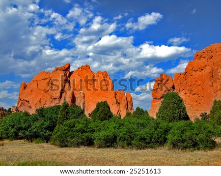 This is a beautiful photograph of the giant orange rocks at Garden of the Gods on a sunny day in Colorado Springs CO.