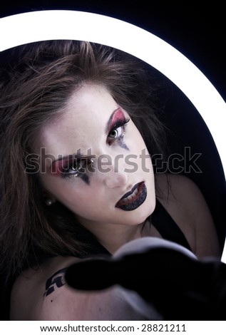 Dramatic portrait of young woman with  dramatic makeup