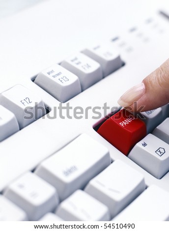 Finger pushing Panic key on Keyboard