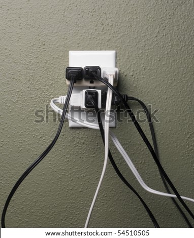 Multiple electrical plugs in wall outlet