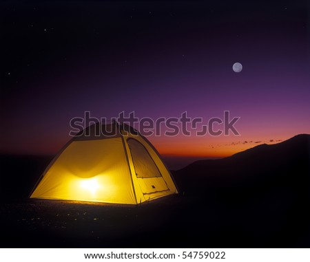 Illuminated Yellow Camping tent at Night