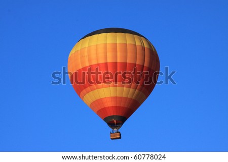 Balloon rising on a clear morning