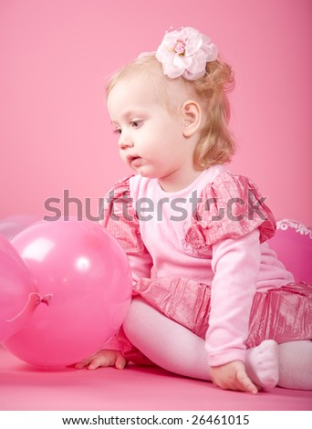Dreaming girl with pink balloons