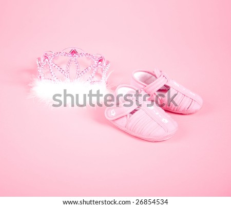 Pink baby shoes and crown