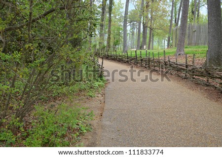 gravel path with stick fence