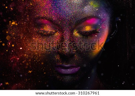 Bright neon make-up, creative body art on the theme of space and stars