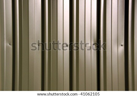 Olive Green Metal Fencing with vertical segmentation. Background texture