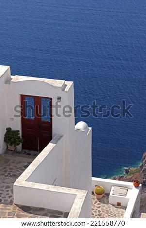 Terrace with a door to the sea. View to the caldera in Santorini island, Greece