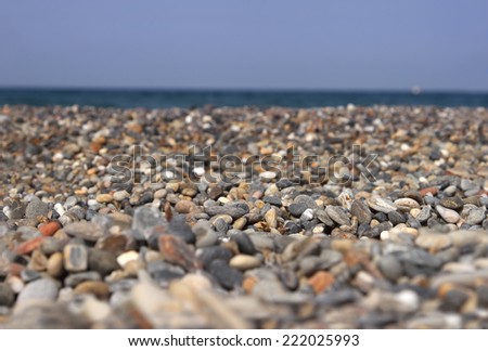 A pebble beach. Focus runs through the middle and falls off on the sides