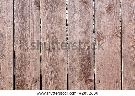 Wood Background. Fragment of an old fence of wood with knots