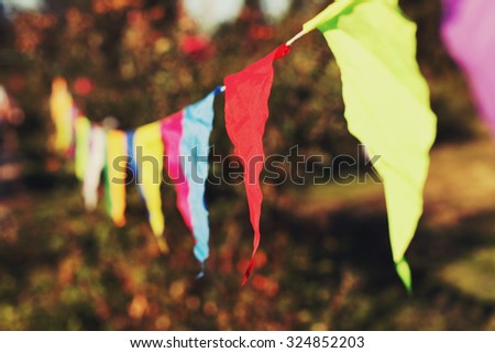 Festive decorations of colored flags. Toned style instagram filters
