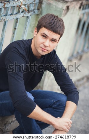 Portrait of young attractive man on a vintage background