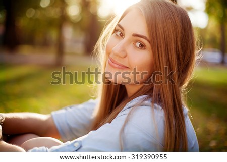 Young pretty girl in autumn park