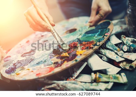 Artist\'s palette, close-up. Selective focus on the foreground. Background image.