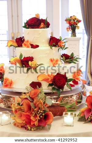 stock photo Wedding Cake with flowers on Table