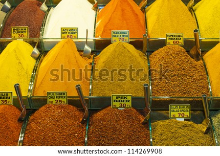Various spices on display at an indoor market stall